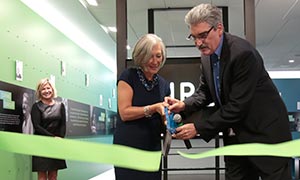 Fred Hutch board chair Paula Reynolds and president Dr. Gary Gilliland cut the ceremonial ribbon at the Visitor Center opening