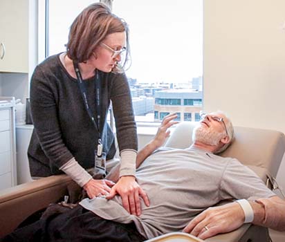 Patient volunteer reclined getting treatment