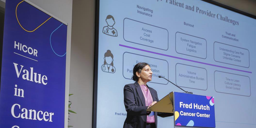 Fred Hutch's Dr. Veena Shankaran stands at a podium at the Value in Cancer Care Summit, held November 6, at Bell Harbor International Conference Center.